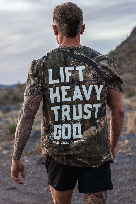 Lift Heavy. Trust God. - Realtree Premium Camo Tee UNISEX MENS