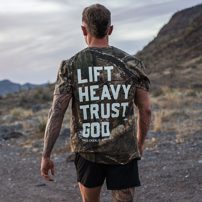 Lift Heavy. Trust God. - Realtree Premium Camo Tee UNISEX MENS